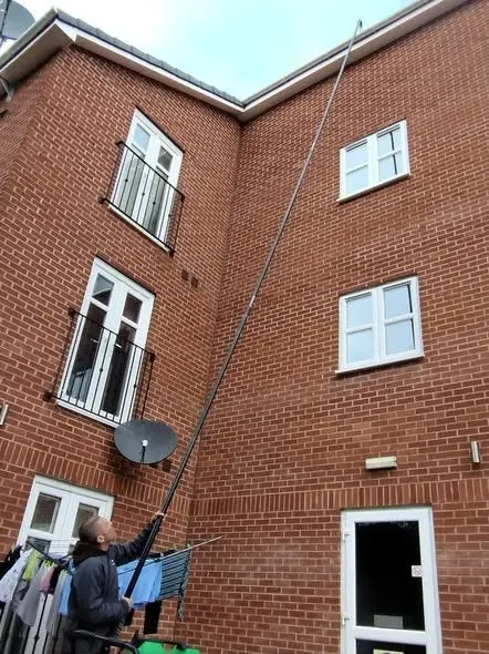 Window cleaning upper-floor apartment windows in Chester
