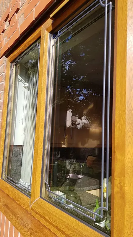 Clean oak-effect uPVC windows after window cleaning in Chester