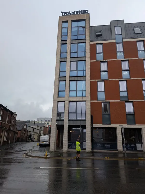 Commercial window cleaning on a multi-storey building in Chester