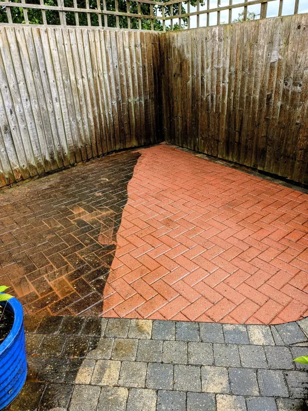 Patio pressure washing in Chester showing cleaned and uncleaned paving