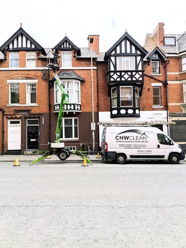 Gutter cleaning from a cherry picker on Tudor-style terraced houses in Chester