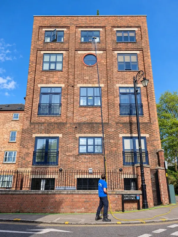 Window cleaning on a five-storey apartment block in Chester