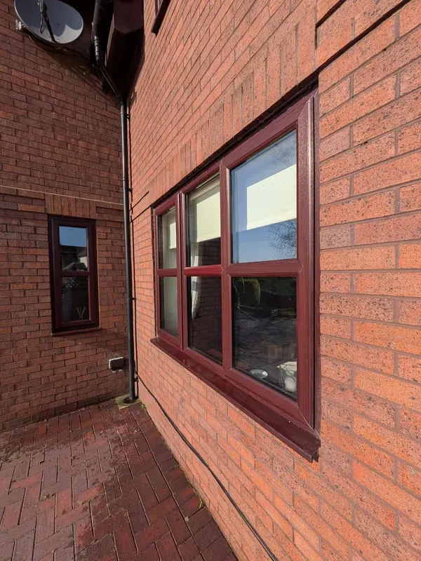 Domestic window cleaning on a brick home in Mold